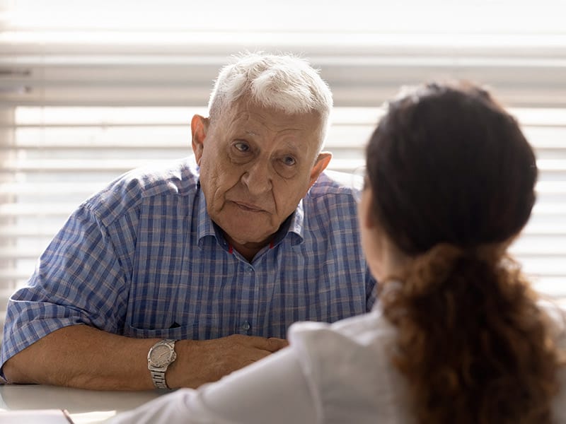 A physician discussing the Medicare BHI Program with one of her Medicare patients.
