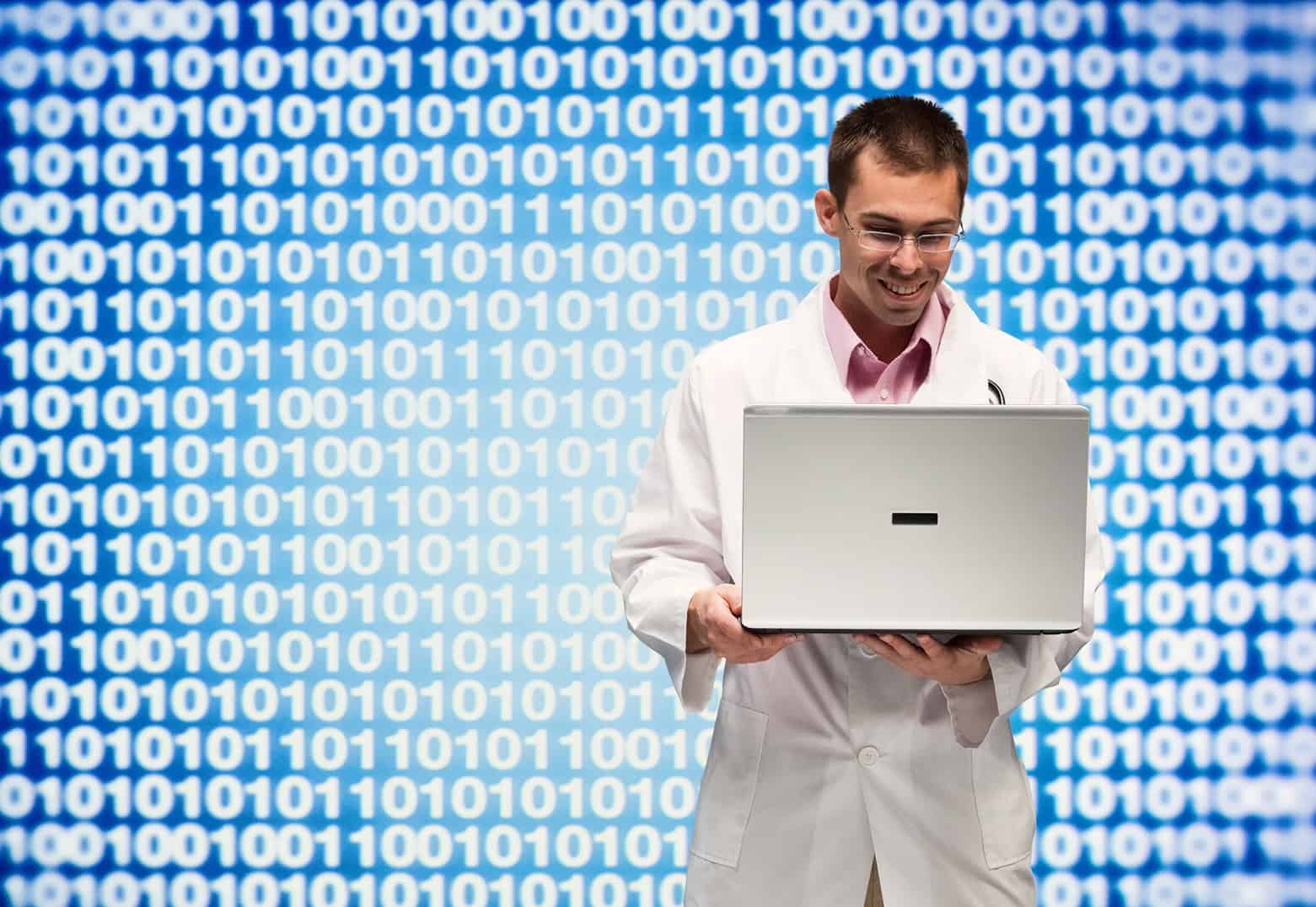 Doctor viewing a population health management system on his laptop.