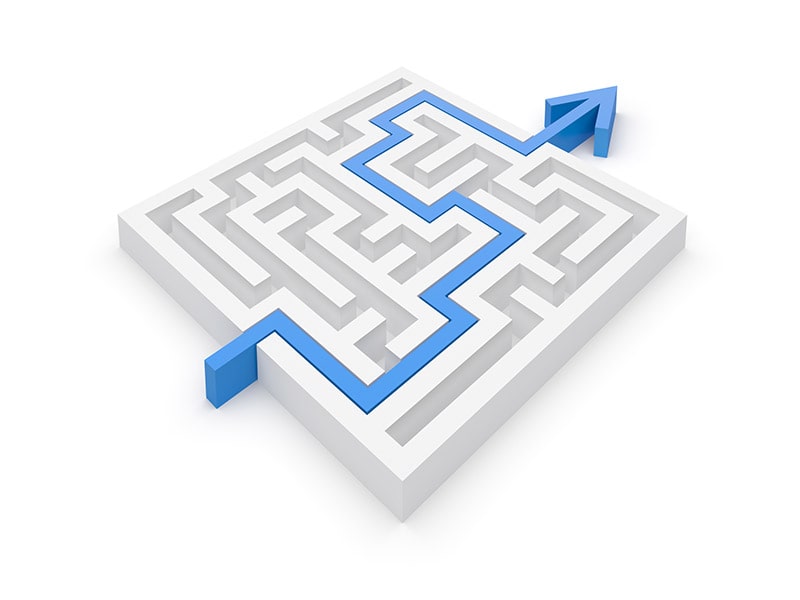 A maze with a blue line moving through it, representing EHR connectivity challenges.